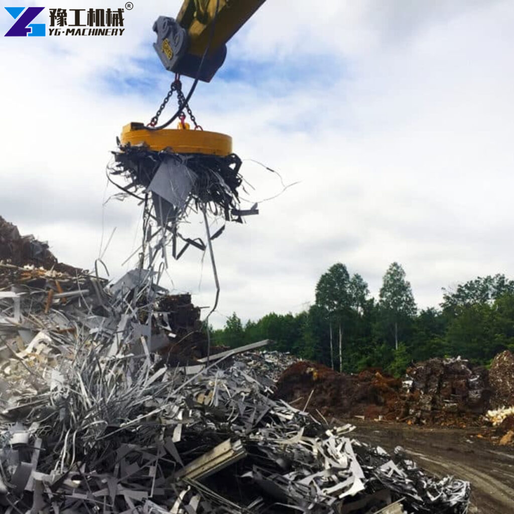 Hydraulic Excavator Magnet Working In Scrap Metal Yard